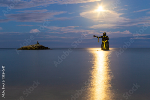 The story of Phra Abhai Mani and Miss ocean Butterfly at Puek Thian beach of the Thailand gulf, located Tha Yang subdistrict Petchaburi Thailand photo