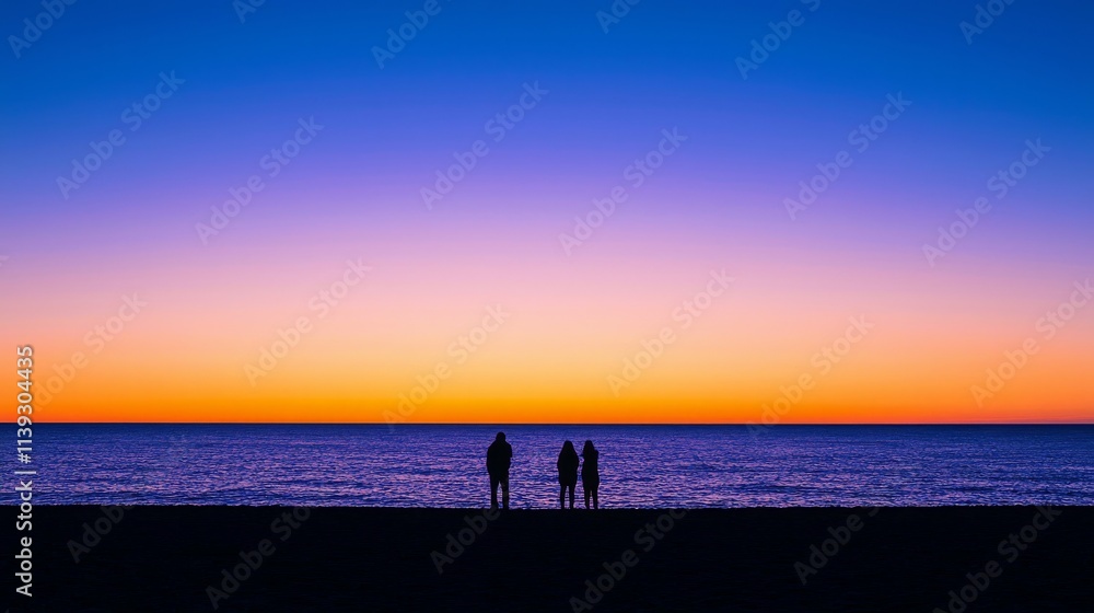 Silhouetted Figures on a Beach at Sunset Silhouetted Figures on a Beach at Sunset