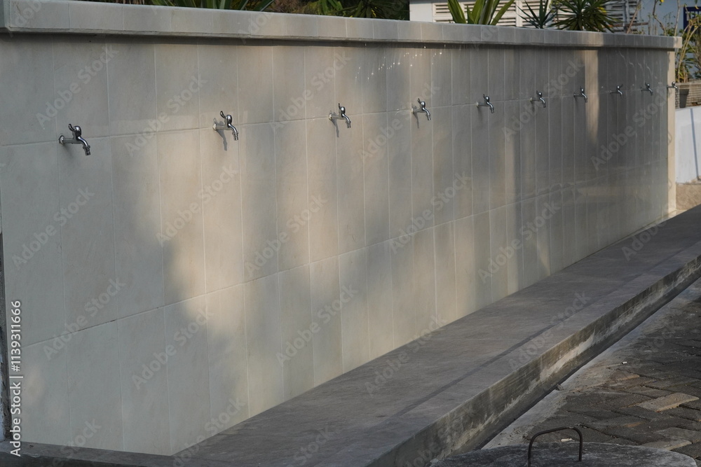 An outdoor ablution place with a minimalist concept in a mosque An outdoor ablution place with a minimalist concept in a mosque