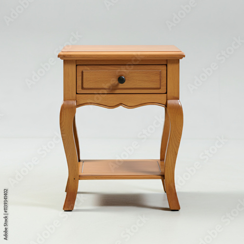 Wooden side table with a drawer and curved legs.