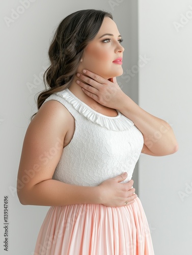 Elegant portrait of a woman in soft dress studio setting fashion