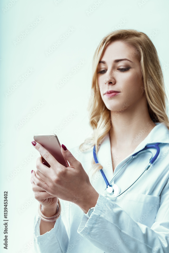 Doctor using smartphone and reading medical news in hospital Doctor using smartphone and reading medical news in hospital