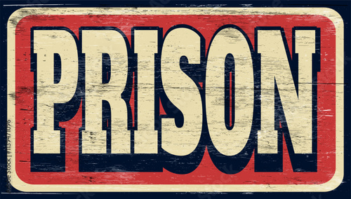 Aged and worn prison sign on wood