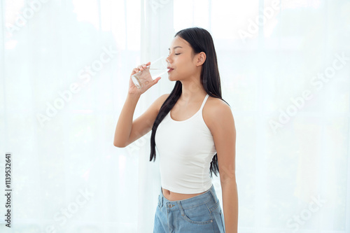 Young asian woman drinking water bedroom at home Free Download Young asian woman drinking water bedroom at home - GFXLoad
