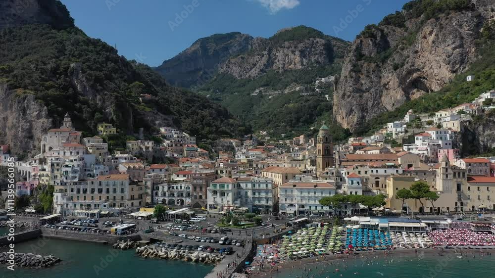 Aerial view of Amalfi town center, coast, sea and boats in marina on a sunny summer day, Italy Aerial view of Amalfi town center, coast, sea and boats in marina on a sunny summer day, Italy