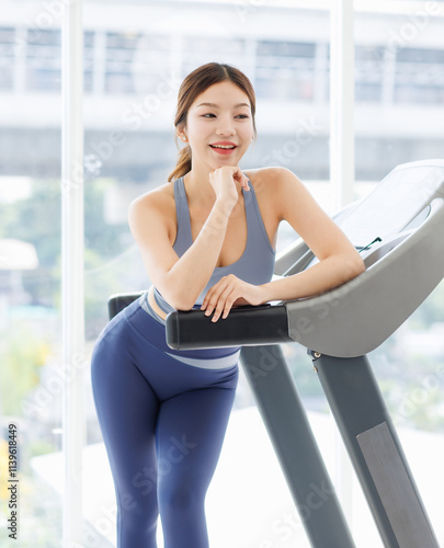 Free Download Asian young beautiful cheerful woman, active sport girl in sportswear exercise standing pose at treadmill training in fitness gym or living room smiling look at camera health care wellness lifestyle. - GFXLoad
