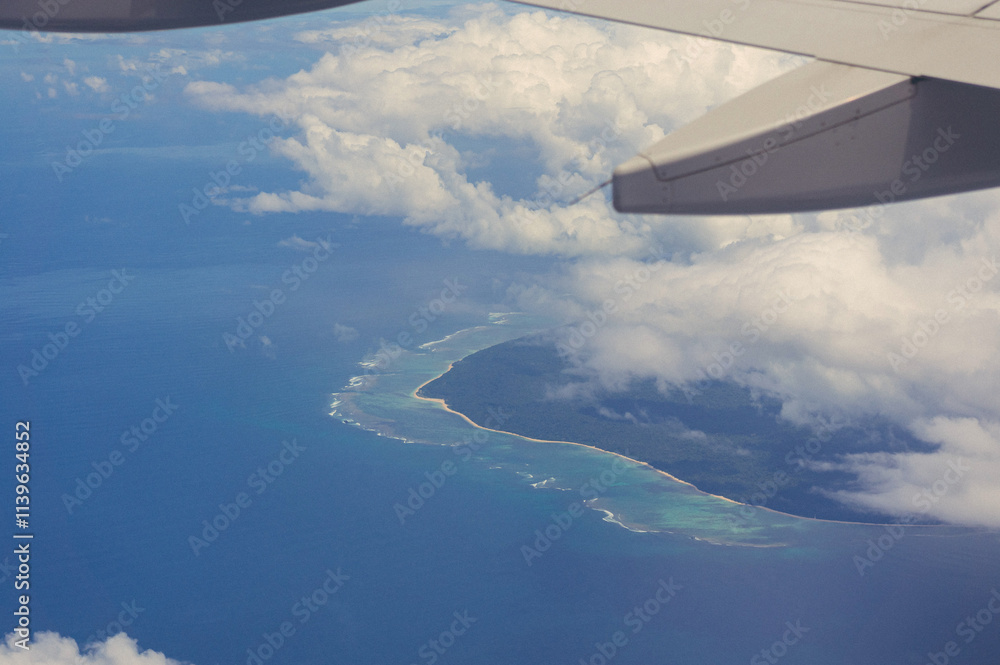 Cropped image of airplane flying overcoral reef in Indonesia Cropped image of airplane flying overcoral reef in Indonesia