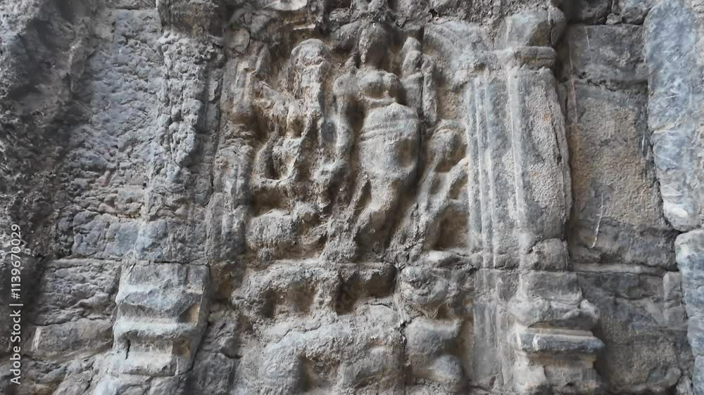 Weathered carvings on the ancient Martand Surya Temple in Jammu and Kashmir, showcasing intricate historical artistry Weathered carvings on the ancient Martand Surya Temple in Jammu and Kashmir, showcasing intricate historical artistry