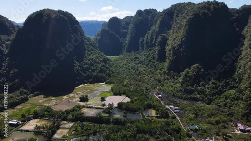 Towering Karst Mountain Range (limestone) Of Rammang-Rammang In Maros Near Makassar, South Sulawesi, Indonesia. Aerial Drone Shot photo