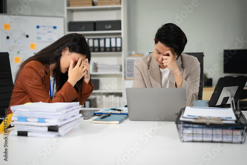 Businessman team working are under stress from financial data and report graph.