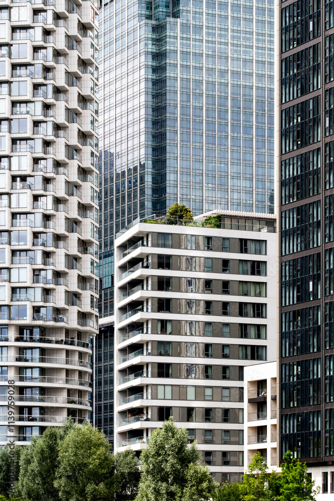 The urban skyline featuring diverse modern buildings highlights the architectural evolution, showcasing a blend of styles and heights set against a lush green foreground in London UK The urban skyline featuring diverse modern buildings highlights the architectural evolution, showcasing a blend of styles and heights set against a lush green foreground in London UK