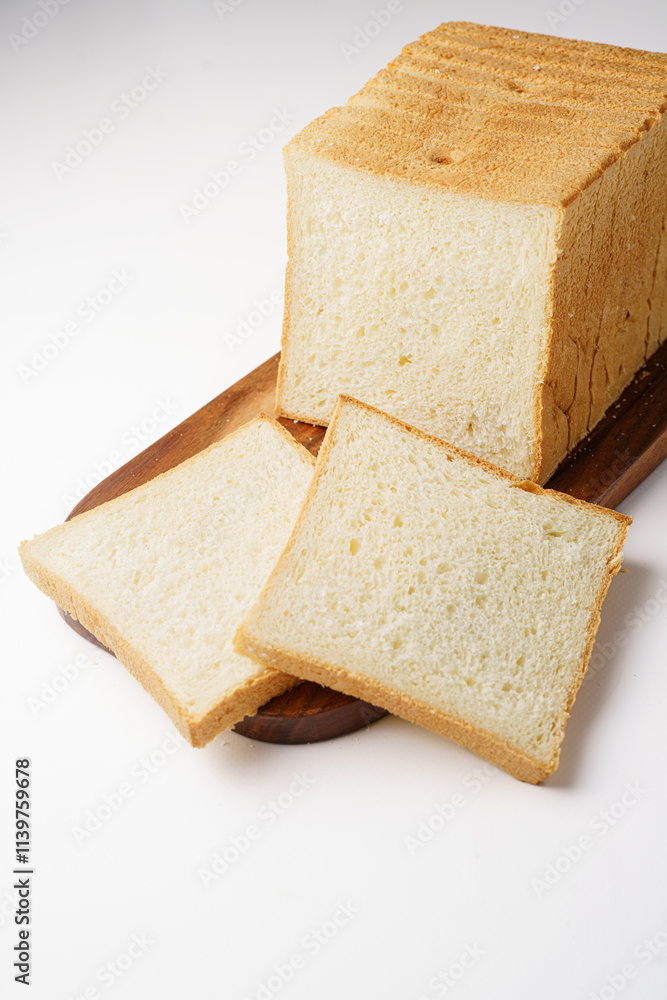 Sliced toast bread on board white background isolated background Sliced toast bread on board white background isolated background