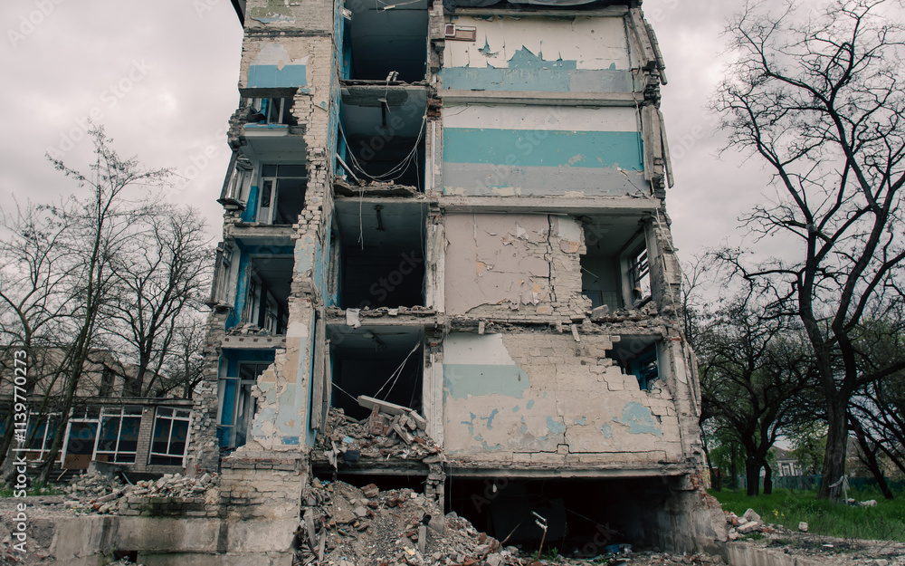 Fototapeta premium destroyed and burned houses in the city in Ukraine