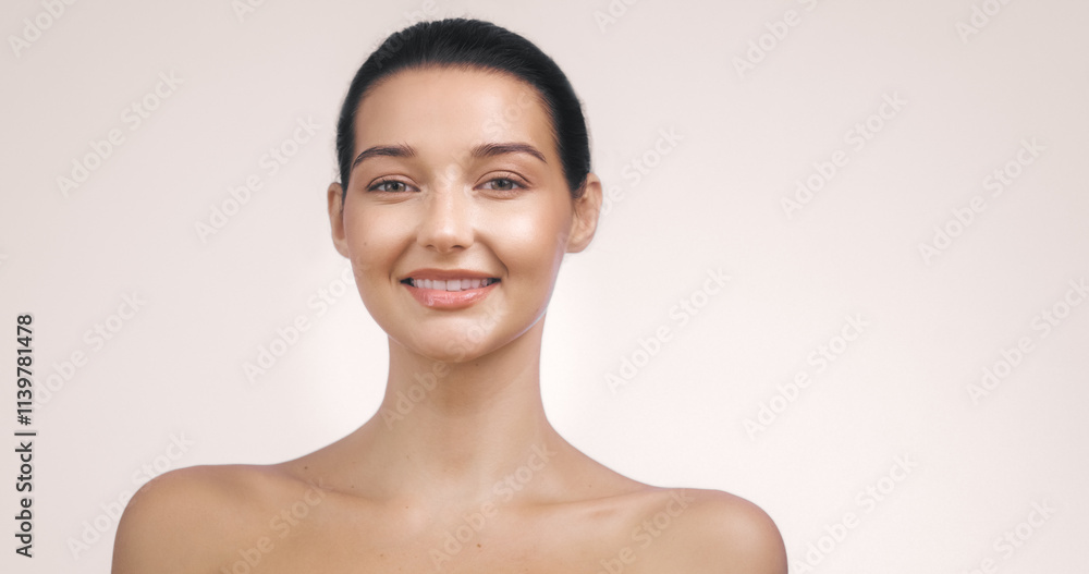 Close-up portrait of a young Caucasian woman with glowing, radiant skin smiling against a pink background. Perfect for beauty, skincare, and wellness themes. High quality image suitable for Close-up portrait of a young Caucasian woman with glowing, radiant skin smiling against a pink background. Perfect for beauty, skincare, and wellness themes. High quality image suitable for