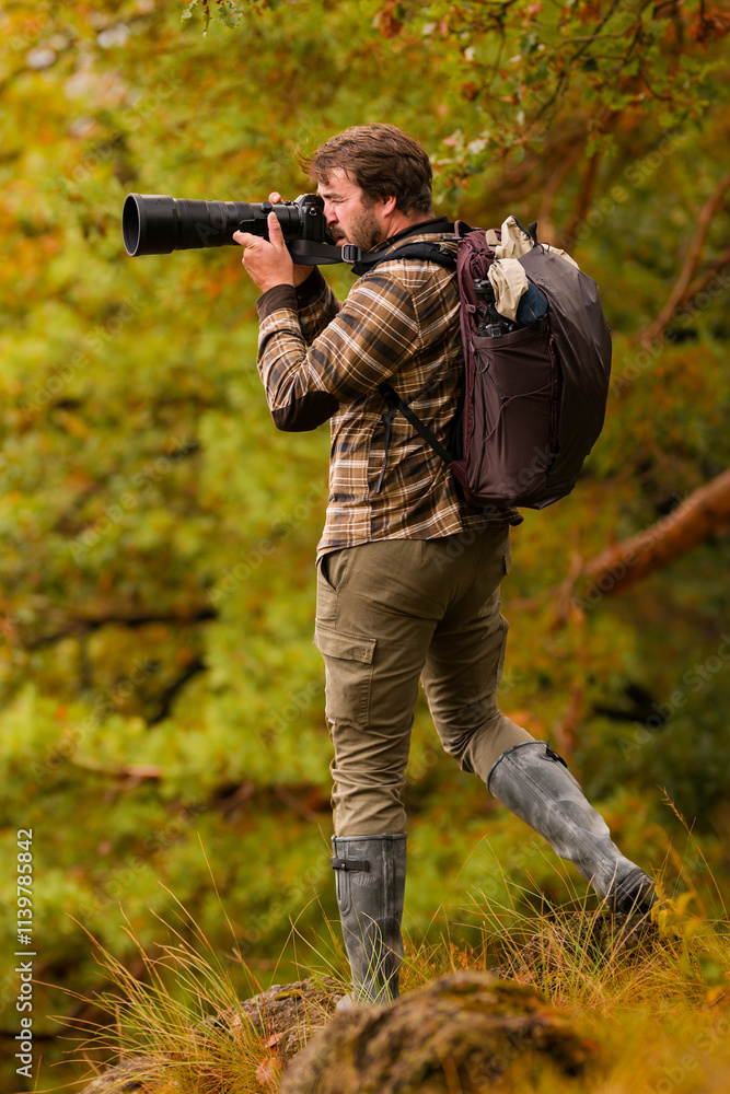 Nature photographer. Young male photographer autumn season outdoors portrait. Back view. Landscape photographer taking photos. Nature photographer. Young male photographer autumn season outdoors portrait. Back view. Landscape photographer taking photos.