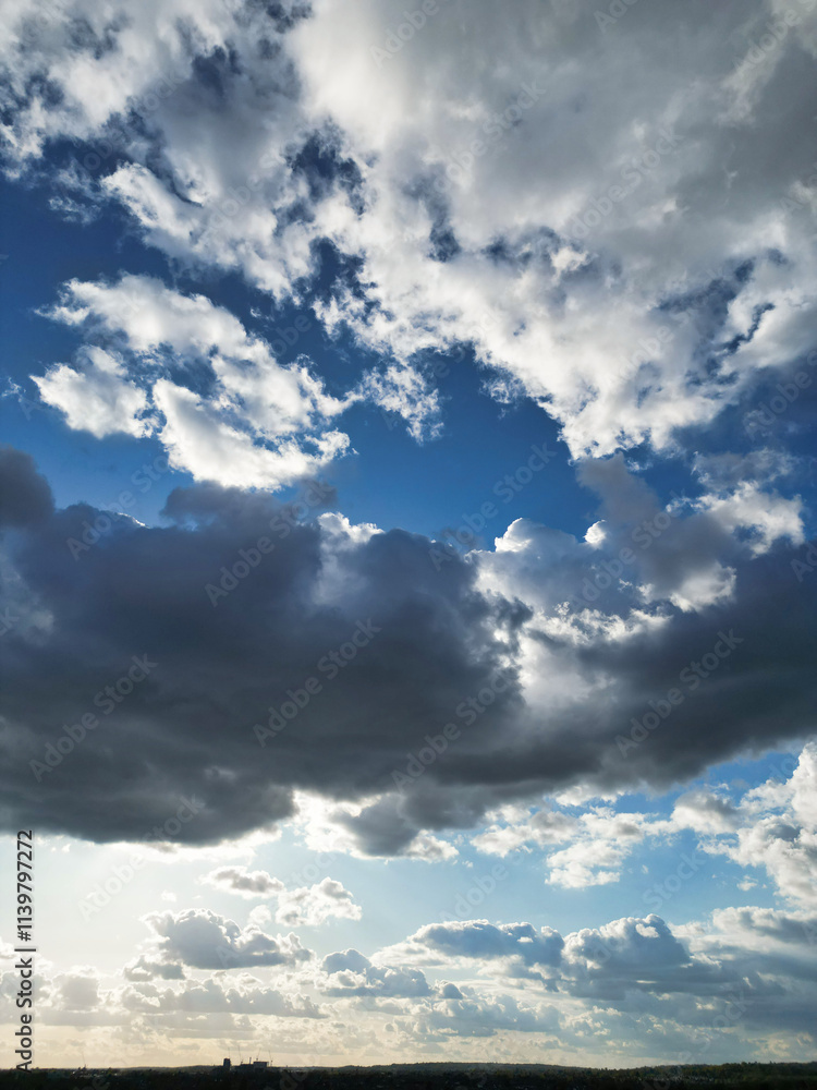 Obraz premium High Angle Gorgeous Winter Unique and Dramatic Clouds and Sky over City of England Great Britain. Aerial Footage Was Captured with drone's Camera from High Altitude