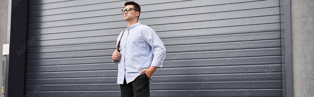 Handsome young man wearing a stylish casual outfit, exuding confidence.