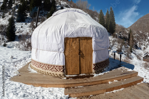 Traditional Central asian nomadic home yurt with a wooden door in the Tian Shan mountains. photo