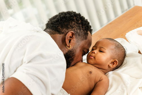 A tender moment between a father and baby, showcasing love and connection in a serene setting. Happy diversity family and newborn bathing concept.