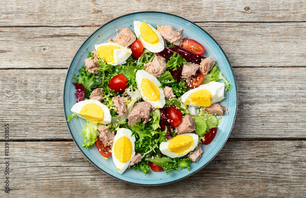 Canned Tuna salad with eggs and tomatoes photography . Top view Canned Tuna salad with eggs and tomatoes photography . Top view