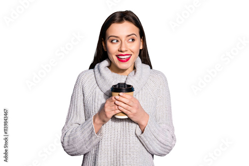 Portrait of cunning lady holding mug looking smiling wearing gray jumper isolated over blue  background photo