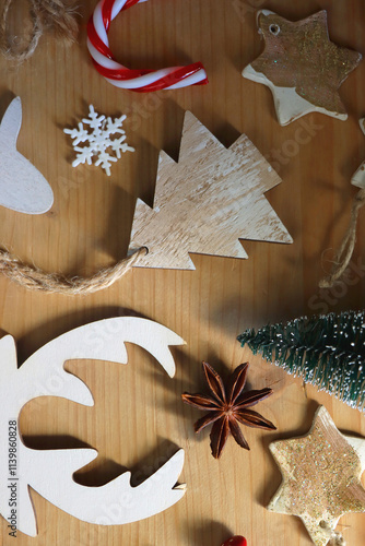 Obraz na płótnie Various Christmas decorations in neutral colors on wooden background. Flat lay. w salonie