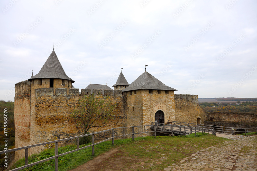 Khotyn fortess, castle in Ukraine in autumn. One of seven wonders of Ukraine. Exterior view of Khotyn Fortress, fortification complex on Dniester bank in Khotyn town, outdoors Khotyn fortess, castle in Ukraine in autumn. One of seven wonders of Ukraine. Exterior view of Khotyn Fortress, fortification complex on Dniester bank in Khotyn town, outdoors