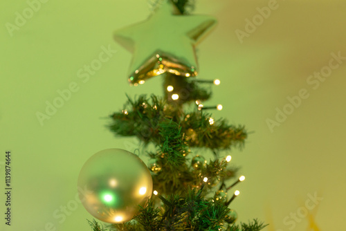 Canvas Print A beautifully decorated Christmas tree with a shining star perched atop it, symb