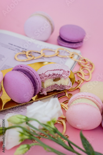 Purple Macarons on a Gold Stand with a Red Background, Golden Decorations and Flowers