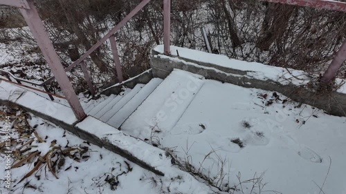 Wallpaper Mural old stairs in snow. slow motion video of concrete stairs with snow falling on them. winter snowy weather. Torontodigital.ca