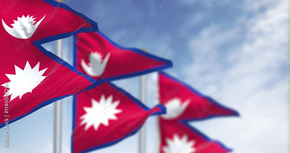 Close-up of Nepal National flag waving in the wind on a clear day Close-up of Nepal National flag waving in the wind on a clear day