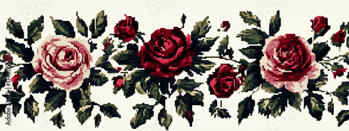 A traditional cross-stitch pattern of stylized roses and leaves in bold red and dark green on a white cotton background