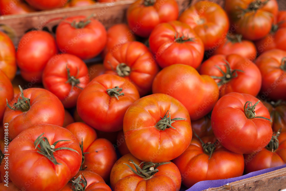 Lots of tomatoes on a branch on counter Lots of tomatoes on a branch on counter