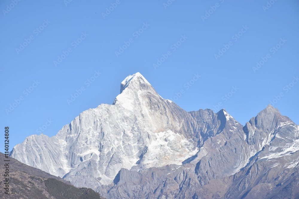 Four Girls Mountain or Siguniangshan as know as Switzerland travel location of China with sky background Four Girls Mountain or Siguniangshan as know as Switzerland travel location of China with sky background