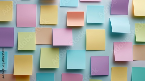 Colorful pastel sticky notes arranged on a wall background