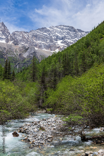 Shuangqiaogou stream and Siguniang Snow Mountain in Aba, Sichuan Province, China photo