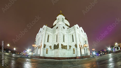 Majestic orthodox Cathedral of Christ Saviour illuminated at dusk on bank of Moscow river. Timelapse hyperlapse, Russia
