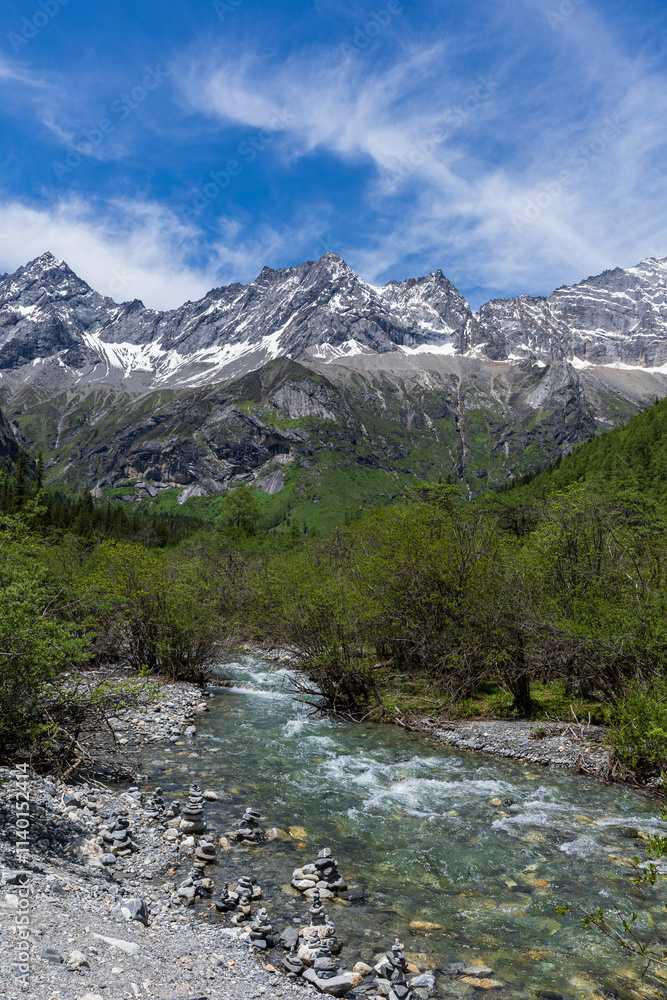 Shuangqiaogou stream and Siguniang Snow Mountain in Aba, Sichuan Province, China Shuangqiaogou stream and Siguniang Snow Mountain in Aba, Sichuan Province, China