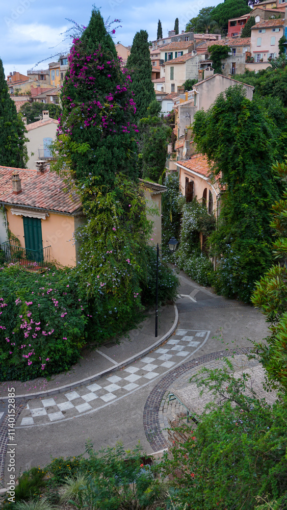Fototapeta premium Panoramic view of houses and roofs of medieval village of Bormes-les-Mimosas, in the Var, in Provence, France