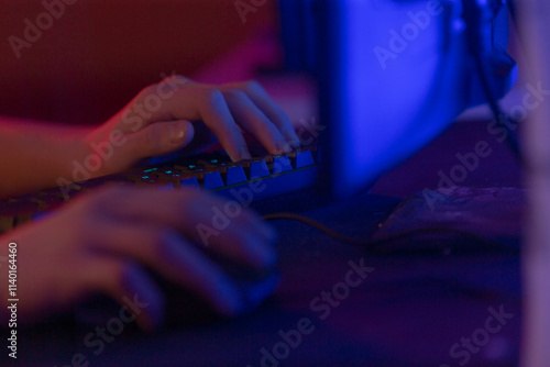 Wallpaper Mural A person is actively typing on a computer keyboard while simultaneously using a mouse to navigate the screen efficiently Torontodigital.ca