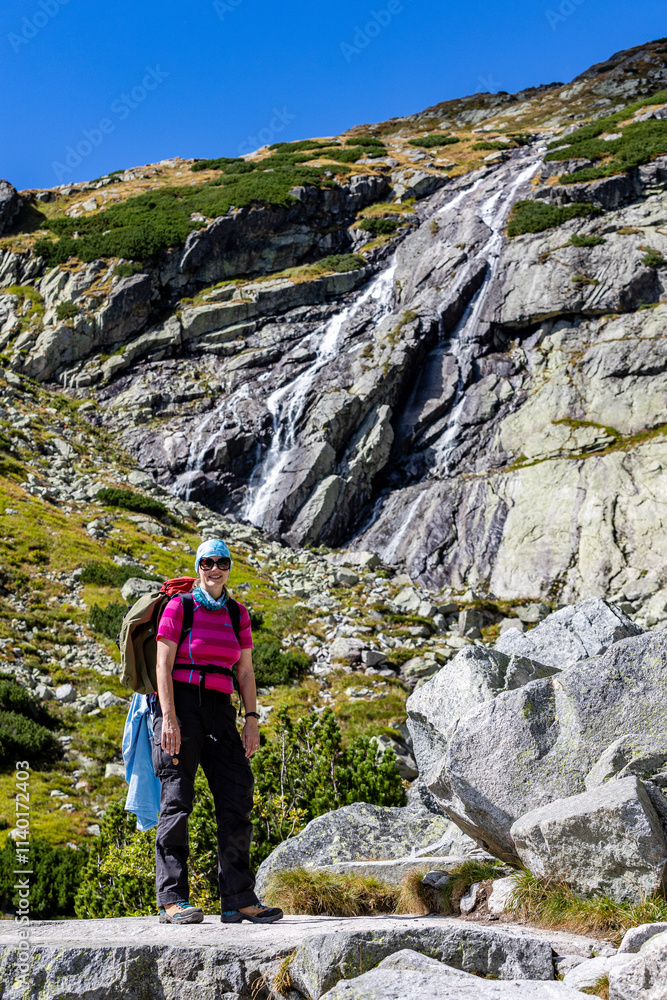 woman is hiking around Téryho chate, high tatra, slovakia woman is hiking around Téryho chate, high tatra, slovakia