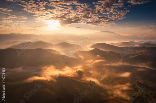 Golden sunrise over Doi Inthanon and foggy hill in harvest season at Chiang Mai