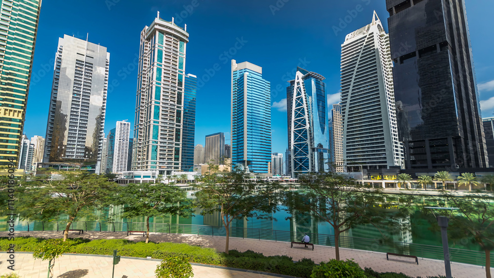 Obraz premium Residential buildings in Jumeirah Lake Towers timelapse hyperlapse in Dubai, UAE.
