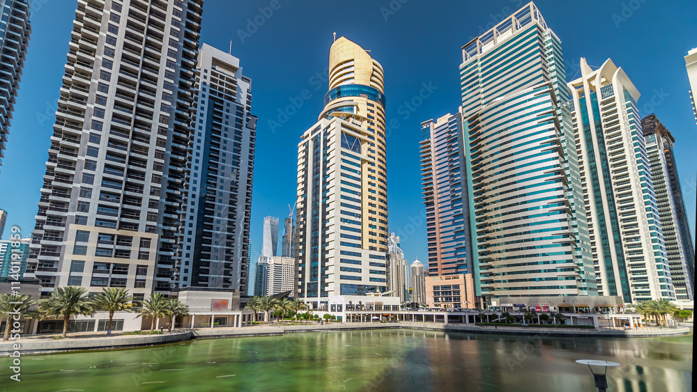 Obraz premium Residential buildings in Jumeirah Lake Towers timelapse hyperlapse in Dubai, UAE.