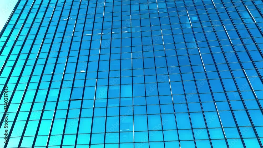 Reflection of the sky and buildings from the windows of the building Reflection of the sky and buildings from the windows of the building