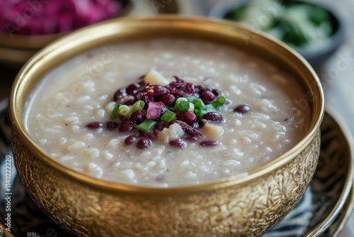 Korean Dish Red Bean Porridge in Golden Bowl photo