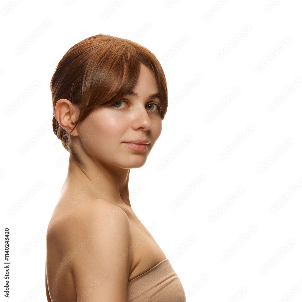 Side view portrait of attractive young woman in beige top, with spotless, clear, spotless skin, posing against white studio background. Concept of natural beauty, skin care, cosmetics and cosmetology Side view portrait of attractive young woman in beige top, with spotless, clear, spotless skin, posing against white studio background. Concept of natural beauty, skin care, cosmetics and cosmetology
