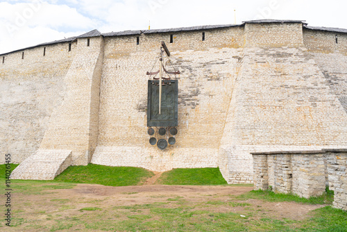 Pskov Kremlin. Dovmonts sword, shield and sword hang on the fortress wall of the Pskov Kremlin. High quality photo photo