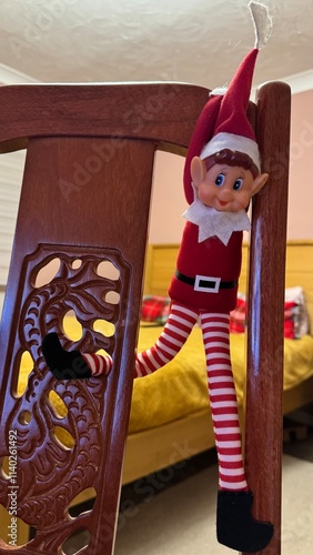 Cheeky Holiday Elf: Playful Mischief on a Chair