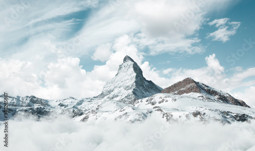 Digital composition of Matterhorn mountain covered by white clouds